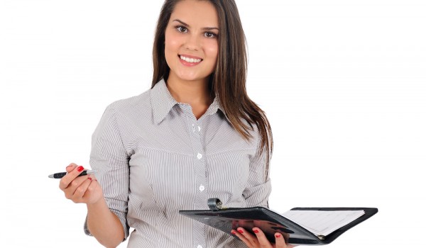 Isolated business woman Isolated young business woman with notebook