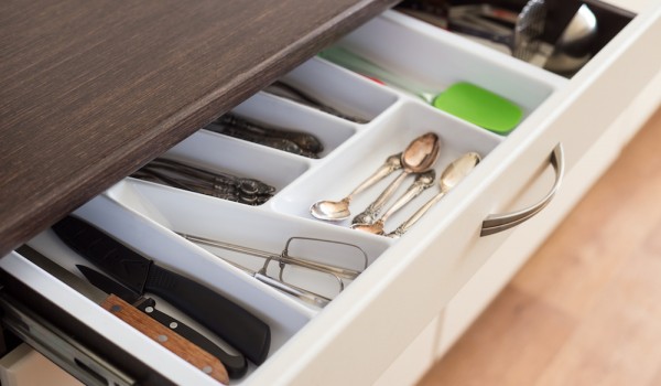 Llanelli Inventory Spoons, forks and knives in cutlery box drawer in kitchen cupboard.